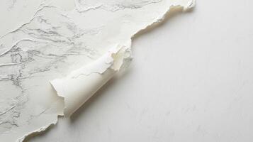 Textured paper is partially torn, revealing its layered structure. The setting appears bright and inviting, suggesting a craftsman's workspace filled with creativity photo