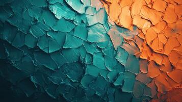 Swathes of teal and orange paint create a dynamic texture on a canvas, showcasing an artistic blend of colors. The surface has a layered, tactile appearance, inviting touch photo
