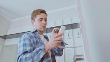 The intercom technician performs diagnostics and adjusts the system, ensuring reliable operation in your home. video