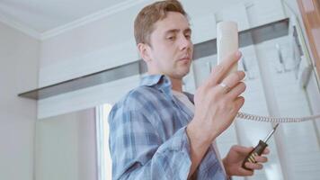 The specialist replaces intercom components, ensuring stable and secure system operation. video