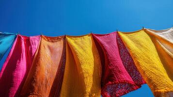 A colorful cloth hanging on a clothesline photo