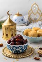 Bowl Of Dates On Table Blue and White Dish with Dates photo