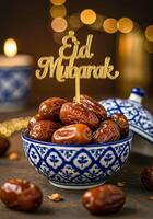 Ornate Blue and White Dish with Dates and Eid Mubarak Topper in Soft Focus photo
