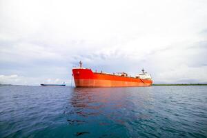 Industrial Ship Anchored in Open Sea. Offshore Cargo Vessel Floating on Calm Ocean Waters. Offshore Supply Ship Waiting for Operations in Open Water photo