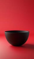 Empty ceramic black bowl no label mockup brand identity on red background photo