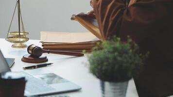 Lawyer working at desk with laptop and books video