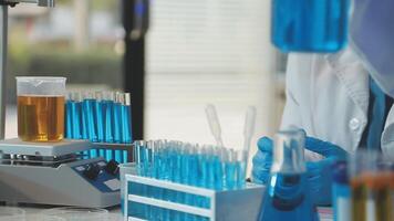 A person in a lab coat is working on a project video