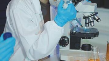 A person in a lab coat is looking at something video