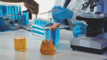 A laboratory with a microscope and some liquid video