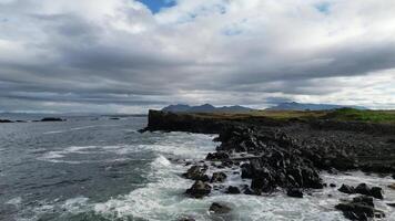 Wild rocky oceanic shore with waves and cold nordic polar weather video