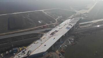Bridge construction progress, assembling a modern highway overpass video
