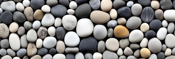 A wall of pebbles with different colors and sizes photo