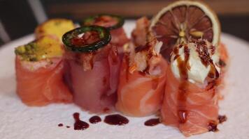 Gourmet Sushi Rolls Topped with Jalapeno and Lemon video