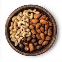 Mixed Nuts Placed in a Wooden Bowl on a White Background With a Variety of Textures and Colors in the Arrangement photo