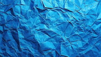 Crumpled blue paper background photo