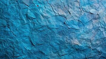 Crumpled paper texture background with blue color photo