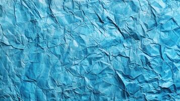 Crumpled blue paper texture background photo