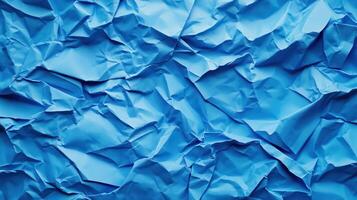 Crumpled blue paper background photo