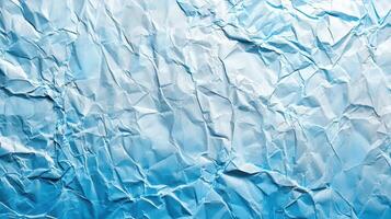 Crumpled paper background with blue and white crumpled texture photo