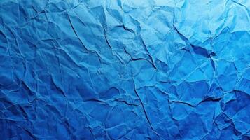 Crumpled paper background with blue color photo