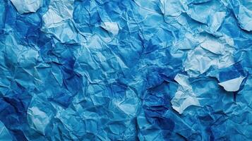 Crumpled paper background with blue crumpled paper photo