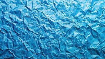 Crumpled blue paper texture background photo