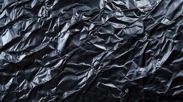 A black background with crumpled paper photo