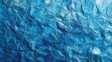 A blue crumpled paper texture with a red dot photo