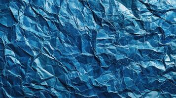 Crumpled blue paper texture background photo