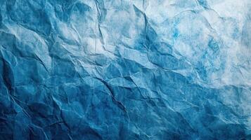 Blue crumpled paper texture background photo