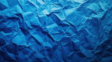 Crumpled blue paper background photo