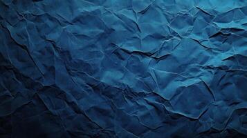 Crumpled paper background with dark blue color photo