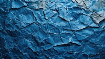 Crumpled blue paper background with a white background photo
