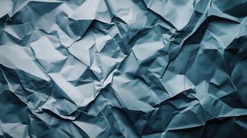 Crumpled paper background with blue color photo