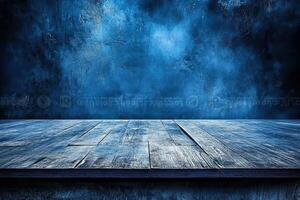 Blue textured backdrop, wooden table, product display photo