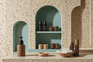 Spa products displayed on shelf, terrazzo wall photo