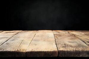 An empty wooden table with a black background photo