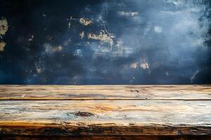 An empty wooden table in front of a blue wall photo