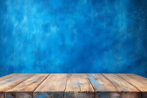 Rustic wood table, blue textured wall backdrop photo