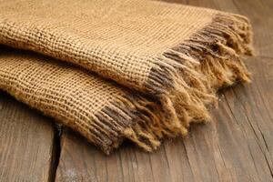 A close-up of burlap fabric with frayed edges. photo