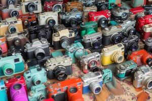 A collection of various vintage and modern cameras. photo