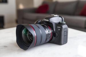 Camera with a large lens on a marble surface. photo