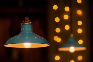 Blue pendant lamps with warm bokeh background. photo