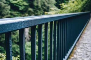 Close-up of a railing along a scenic pathway. photo