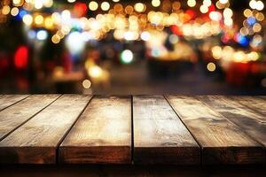 Blurred lights with a wooden table foreground. photo