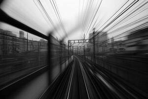 Blurred view from a moving train on a cityscape. photo
