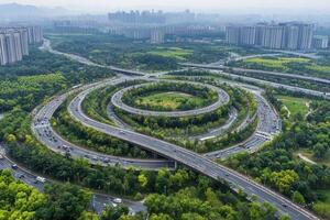Aerial view of a spiral highway surrounded by greenery. photo