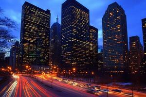 City skyline at dusk with light trails from traffic. photo