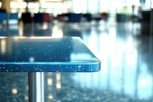 Close-up of a blue table surface in a spacious area. photo