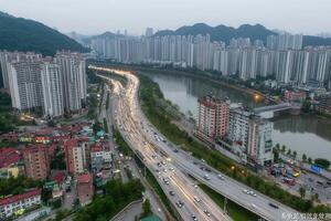 Aerial view of a cityscape with river and traffic. photo